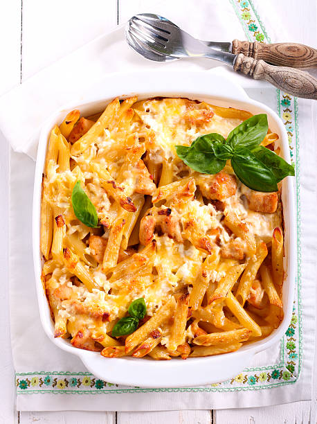 Chicken breast  and cheese rigatoni bake Chicken breast  and cheese rigatoni bake  in a tin chicken rigatoni stock pictures, royalty-free photos & images