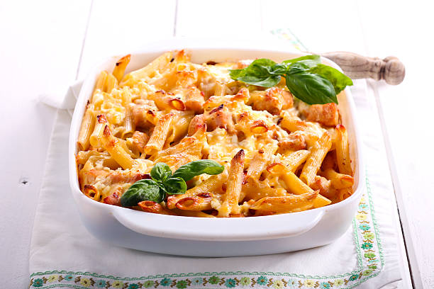 Chicken breast  and cheese rigatoni bake Chicken breast  and cheese rigatoni bake  in a tin chicken rigatoni stock pictures, royalty-free photos & images