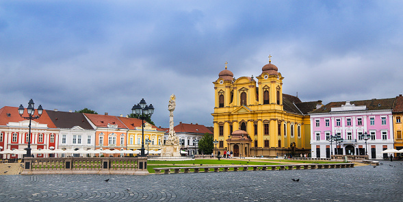 Panorama of Piata Unirii (Unirii Square) and Catholic Cathedral of Saint George in Timisoara, Romania.