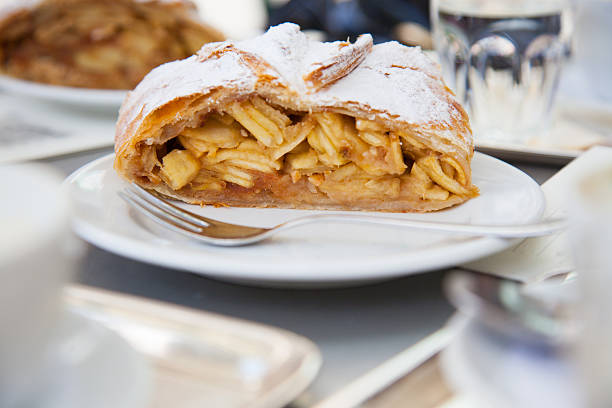 apple strudel close-up of typical Austrian dessert at a cafe apple strudel stock pictures, royalty-free photos & images