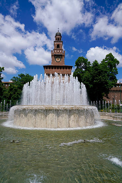 istock water fountain in front of a red steeple 598671384
