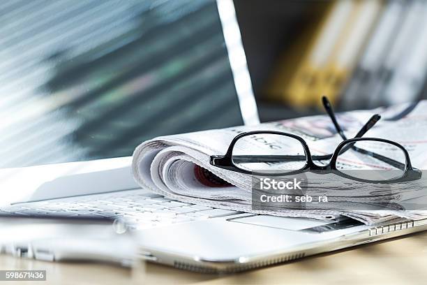 Newspaper On Laptop Stock Photo - Download Image Now - Newspaper, The Media, Journalism