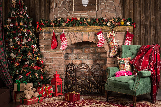 christmas decorations of the room: fireplace, chair, tree - christmas tree fotos imagens e fotografias de stock