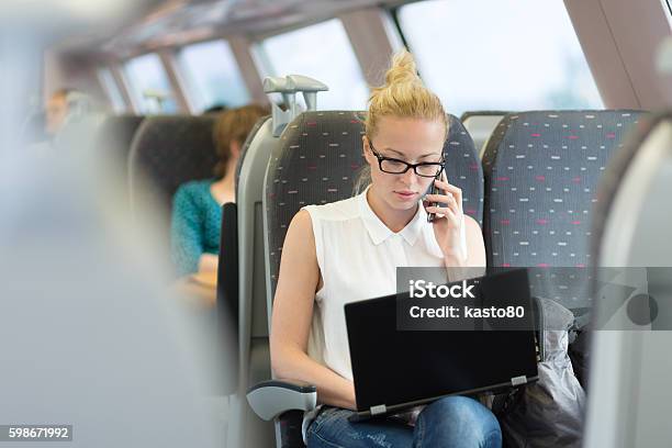 Business Woman Working While Travelling By Train Stock Photo - Download Image Now - Train - Vehicle, Working, Travel