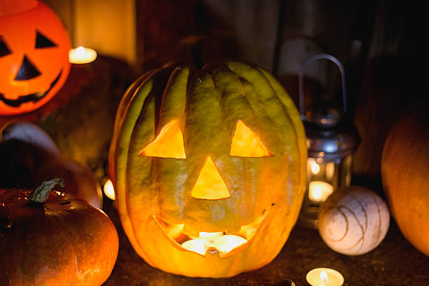 istock Halloween pumpkin head jack lantern on wooden background 598672374