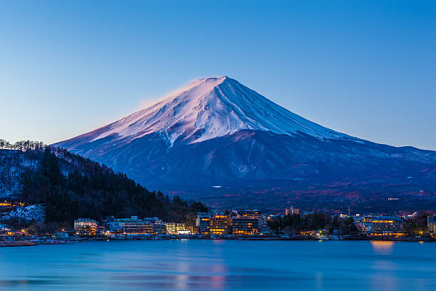 istock Mount Fuji at dawn from Fuji Lake Kawaguchi during winter 598673940