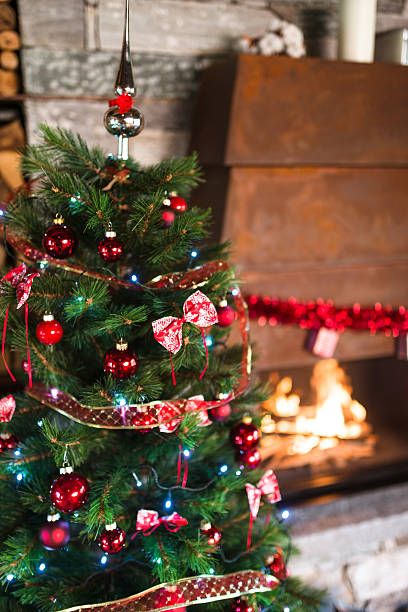 istock living room with christmas tree and the fireplace 598674624