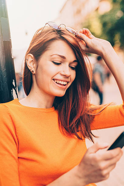 istock Woman texting outdoor 598675188