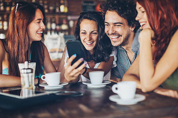 istock Friends with smart phone in cafe 598675598