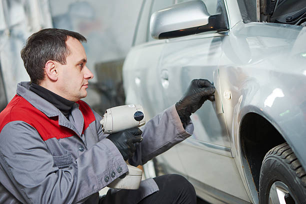 istock colourist man compare color sample with car paint 598675764