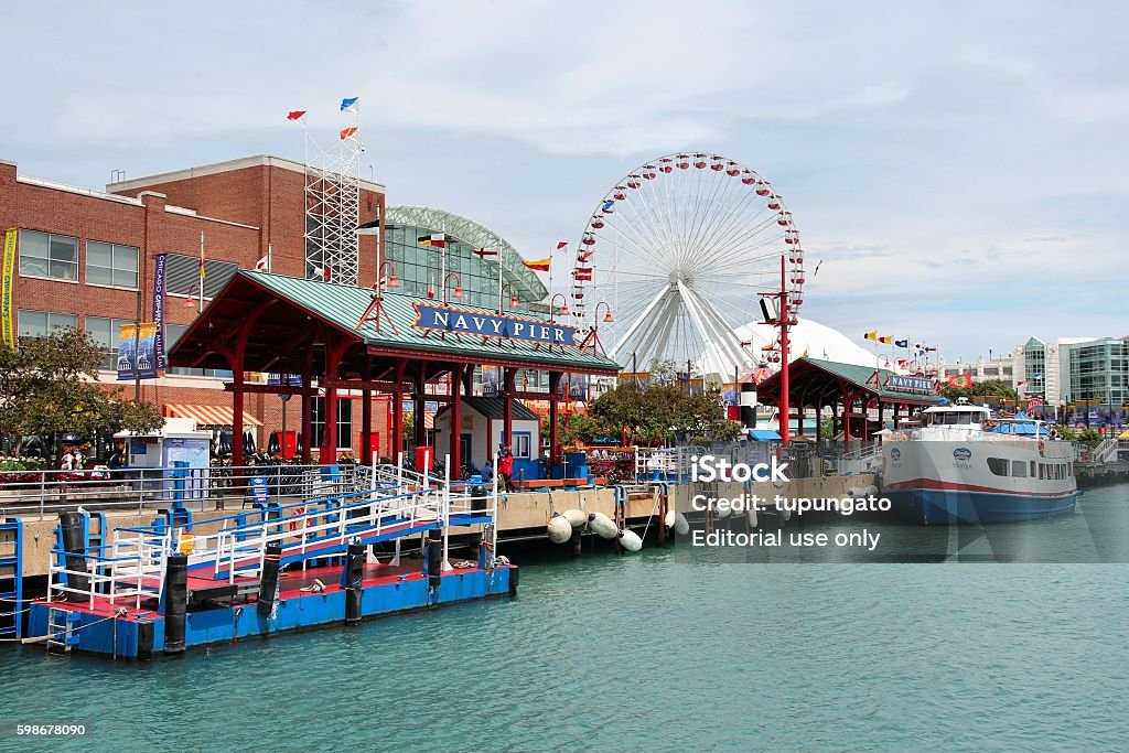 Navy Pier, Chicago Chicago, United States - June 26, 2013: People visit famous Navy Pier on June 26, 2013 in Chicago. The 3,300-foot pier built in 1916 is one of most recognized Chicago landmarks. Navy Pier Stock Photo