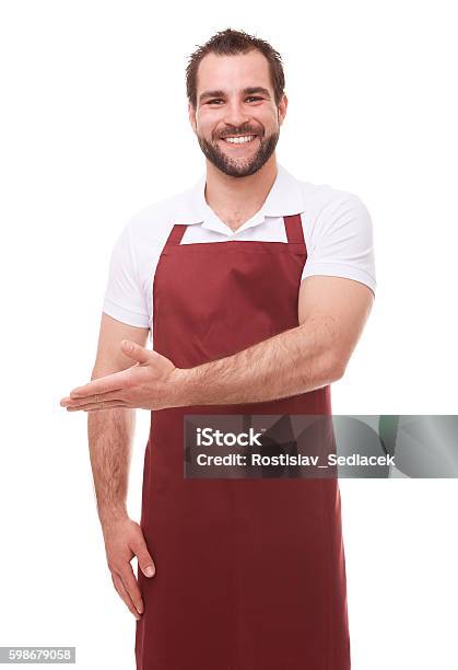 Man With Red Apron Showing Empty Copyspace Stock Photo - Download Image Now - Butcher, Men, Cut Out