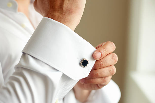 istock Man correcting the sleeve of his shirt 598680040