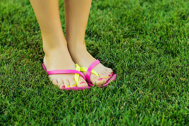 istock Feet in shoes on grass 598680428