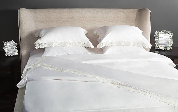 istock Linen white color on a beautiful bed 598684064