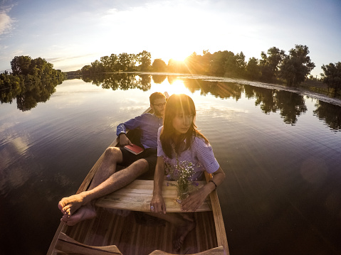 Couple enjoying a canoe ride on the lake.