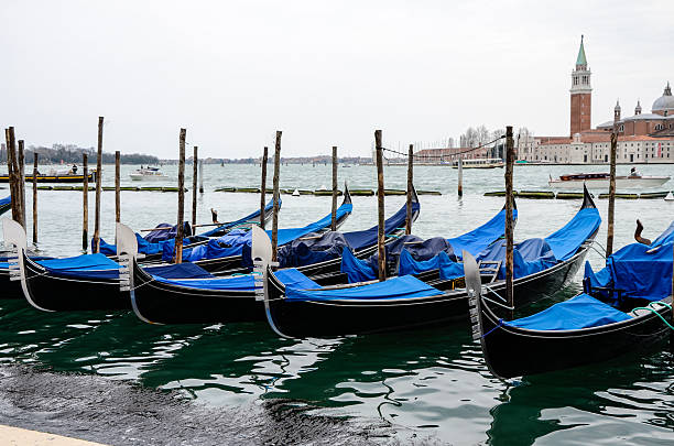 istock Gondolas, blue canvas covered, San Giorgio Maggiore 598691172