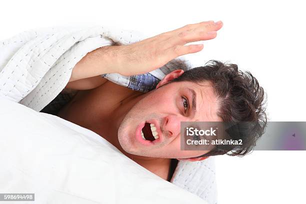 Angry Man Lying In Bed Stock Photo - Download Image Now - Adult, Anger, Beautiful People