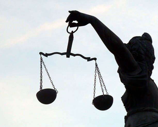 istock Looking At Lady Justice And Summer Blue Sky In Germany.Europe 598694634