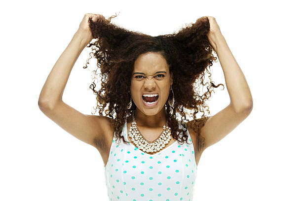 istock Angry woman pulling her hair 598695474