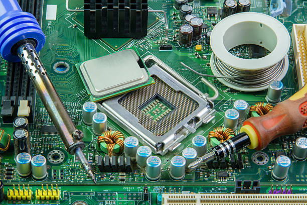 istock Computer motherboard and equipment repair. 598698028