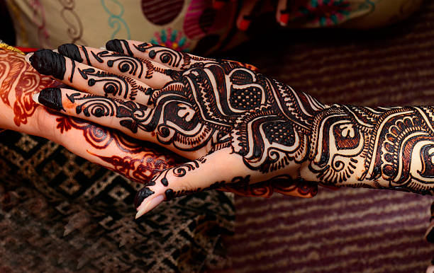 istock beautifully decorated indian hands with mehandi typically done for weddings 598698254