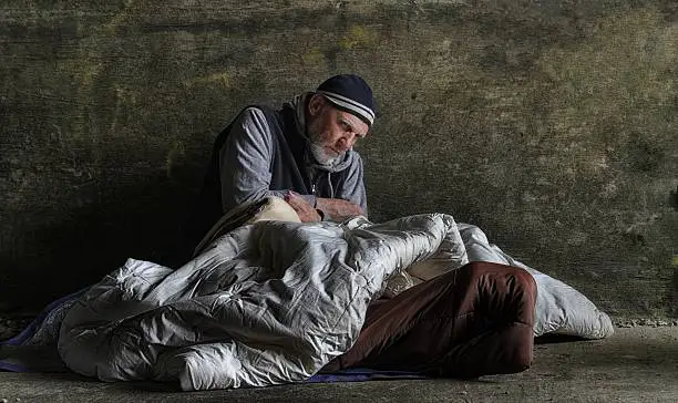 Photo of homeless man sleeping rough