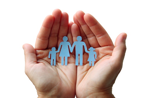Paper family in hands isolated on white background welfare concept