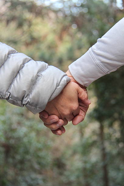 istock Hand in hand together forever on selective focus. 598700660