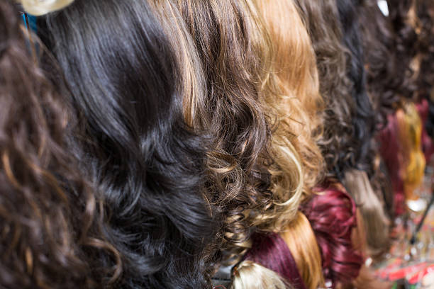 istock Clip-in hair extensions in wig shop 598701030