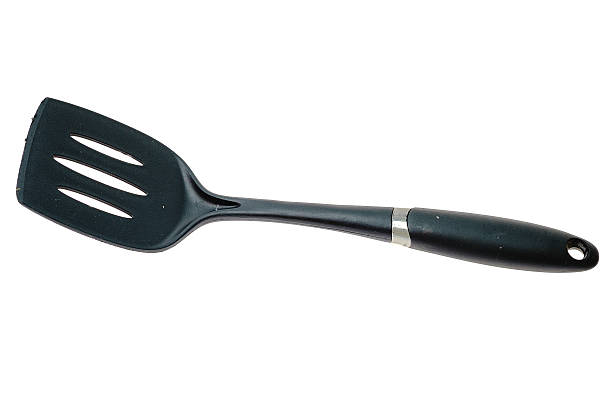 istock Black slotted spatula isolated on white 598703460