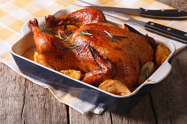 istock baked chicken with apples in the baking dish close-up. horizontal 598705622