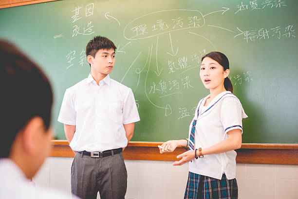 istock Chinese Students Talking about Pollution, Hong Kong, Asia 598706882
