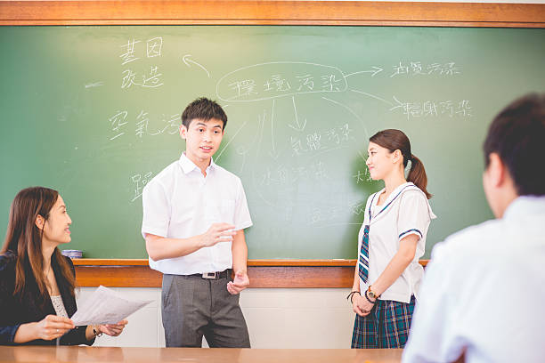 istock Chinese Students Talking about Pollution, Hong Kong, Asia 598707170