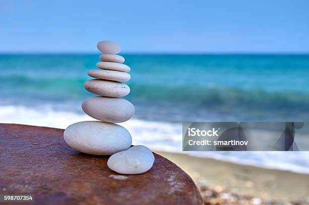 Pile Of White Rocks On A Table Near The Sea Stock Photo - Download Image Now - Consoling, Deep, Beach
