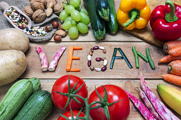 istock vegan word on wood background and vegetable 598708294