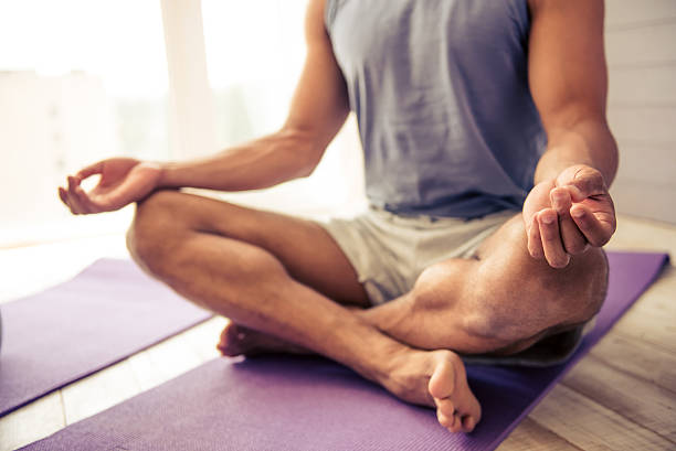 istock Afro American man doing yoga 598708792