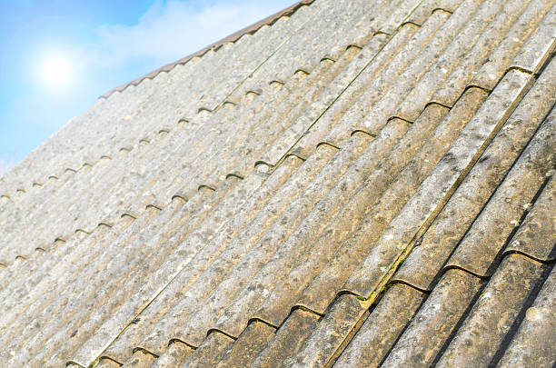 istock Asbestos roof with blue sky 598709068