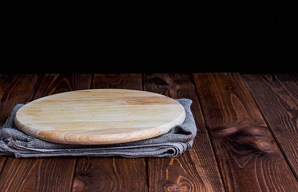 istock Table with round cutting board for product montage 598709938