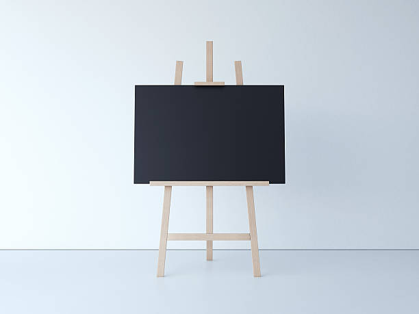istock Wooden easel with blank black canvas. 3d rendering 598710156