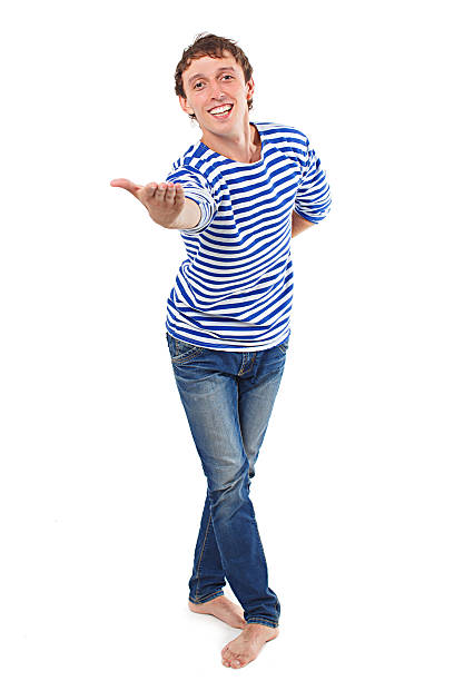cheerful sailor stretches out his hand forward offer something. looking at camera. isolated on white background