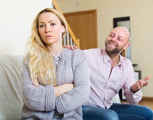 istock Man consoling the depressed woman 598713362