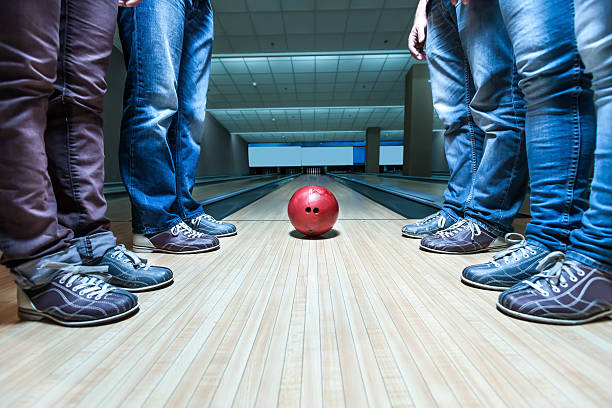istock People near bowling ball 598713518