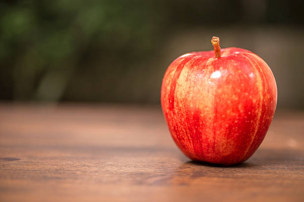 Health, dieting themed scene with red apple
