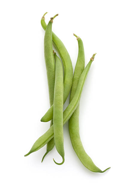 istock Green beans handful isolated on white background cutout 598717758