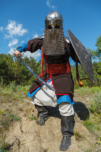 Mongol horde warrior in armour holding traditional saber