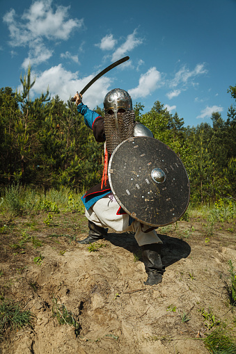 Mongol horde warrior in armour holding traditional saber