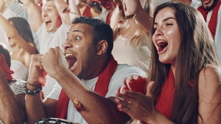 Group of fans cheering for sports team