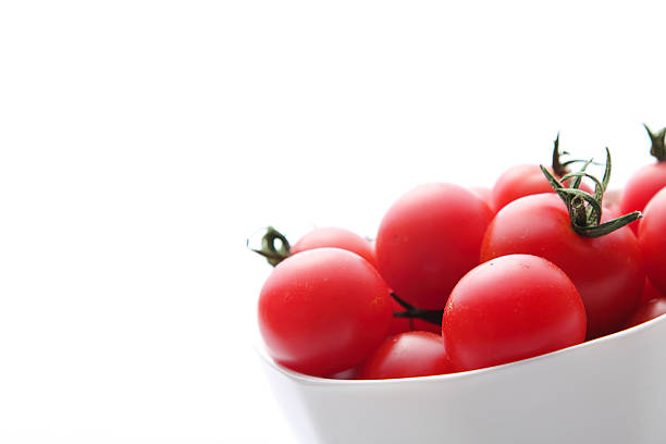 istock Cherry tomato in the bowl on white background 598782790