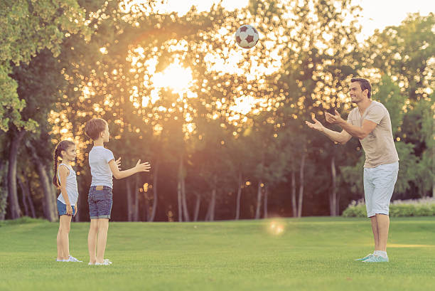 istock Family playing soccer 598783006